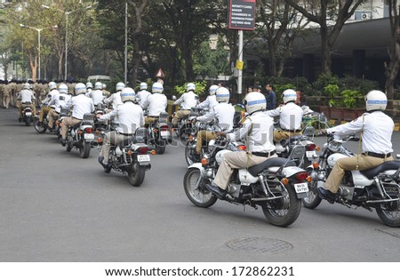 Mumbai, India - January 23, 2014 - Traffic Police riding motorbicycles  parading near Marine Drive  during the rehearsal on 23 January 2014 for India\'s Republic Day to be held on 26 January 2014