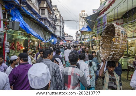 Mumbai, India - July 3, 2014 -  People shopping for food from stalls at at crowded Mohammad Ali Road in the evening during Ramzan fasting month