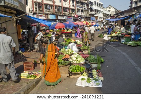 Mumbai, India - March 20, 2014 - People shopping for fresh produces at local market