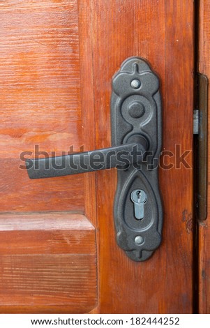 the door handle with the lock is fastened to a door