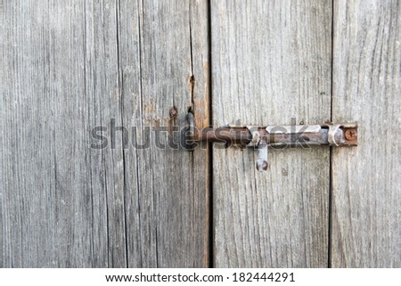 old metal latch a holding door in rural houses