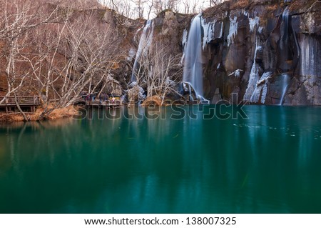 Waterfalls and green pool.The image taken in china`s jilin province, baishan city, changbai mountain scenic spot.The waterfalls white and water green, was cool world.