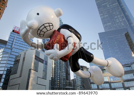 NEW YORK CITY, NY - NOVEMBER 24: Diary of a Wimpy Kid Balloon in front of skyscrapers during the Macy\'s 85th Annual Thanksgiving Day Parade on November 24, 2011 in New York City, New York.