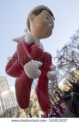 NEW YORK CITY, NY - NOVEMBER 28 : Elf on the Shelf balloon high in the sky during the Macy's 87th Annual Thanksgiving Day Parade on November 28, 2013 in New York City, New York.