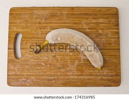 Frozen banana on cutting board