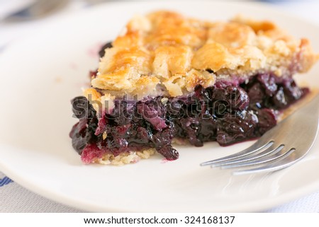 Similar – Image, Stock Photo Sliced blueberry pie. Lattice crust cake top view