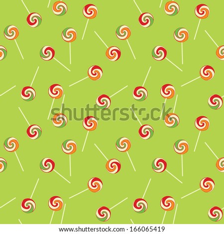 Colorful striped lollipops on green background seamless texture for children room wallpaper or wrapping