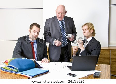 A company director with two of his staff