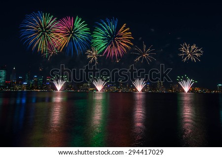 Perth Australia Day Skyworks which is the biggest Australia day fireworks display in Australia celebrating the nation\'s federation. Fireworks over city with reflection in Swan river, Perth city.