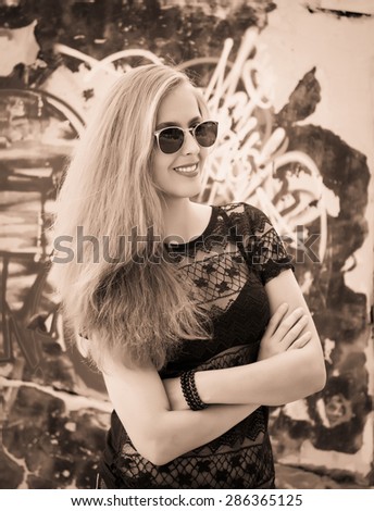 Black and white fashion blond girl portrait with long hair. Glamour beautiful woman with healthy and beauty hair.