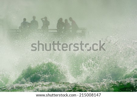 Splashing water and people on a base at the Rhine Falls in Neuhausen (Switzerland)