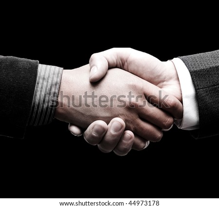 handshake over black background