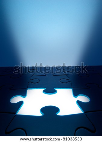 Light coming from the missing jigsaw puzzle: business / human resources concept