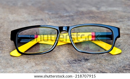 Women's Fashion Eyeglasses on wood background
