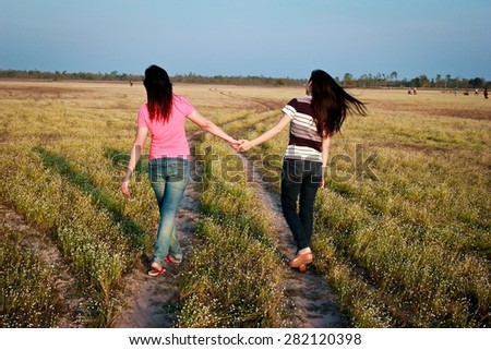 Filter image of friendship concept. Friend walking hand in hand.