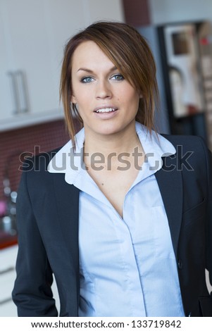 Young business woman in navy blue suit.