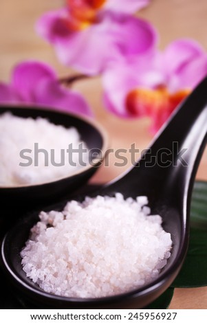 Bath salt on the wooden table. Asian spa massage.