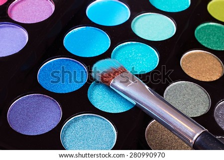 Cosmetic.Makeup blush with blue powder.Close up macro.Eye-shadow pallet for professional make up artist.