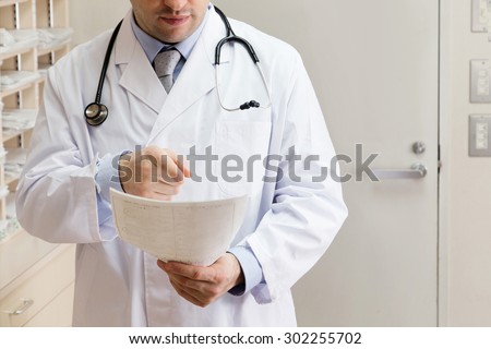 A medical doctor checking the record of patient. Healthy care, medical check.