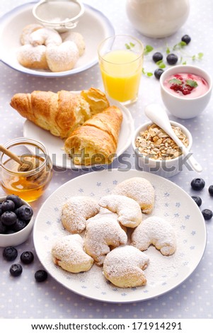 Delicious breakfast. Homemade shortbread cookies,croissant, fruit, yogurt and muesli.