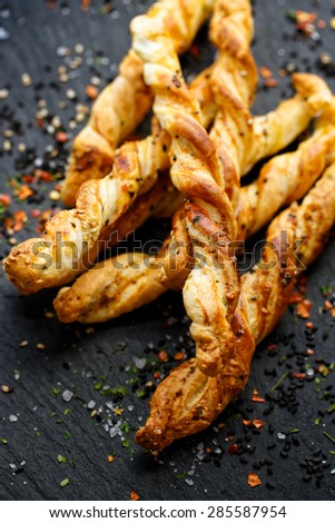 Cheese sticks with puff pastry with chia seeds. Delicious appetizer