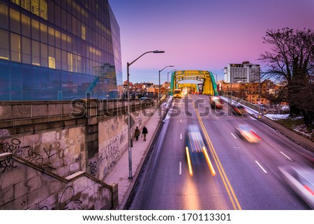 Traffic moving on Howard Street at twilight, in Baltimore, Maryland.