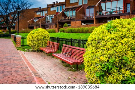 Benches and houses along the Waterfront Promenade in Canton, Baltimore, Maryland.