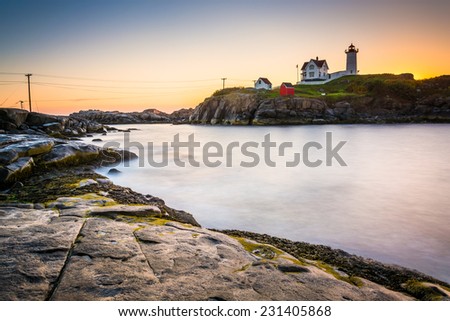 Long exposure of the Atlantic Ocean and Nubble Lighthouse at sunrise, at Cape Neddick, in York, Maine.