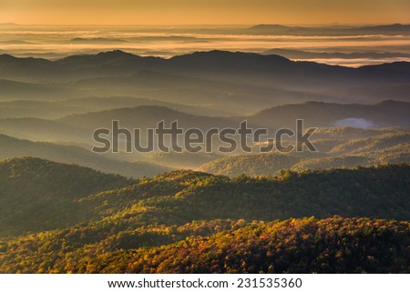 Sun shining through fog in the valley, seen from Beacon Heights, along the Blue Ridge Parkway near Blowing Rock, North Carolina.