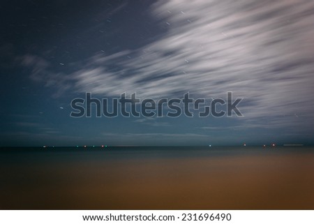 Long exposure of clouds and stars in the sky over the Gulf of Mexico in Key West, Florida.