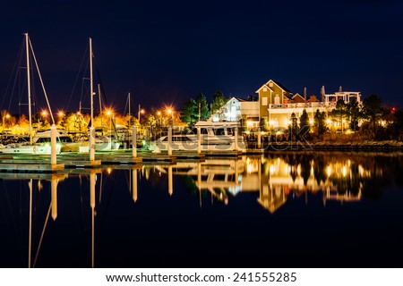 Boats reflecting at night at the Bay Bridge Marina in Kent Island, Maryland.