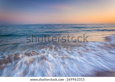 Waves in the Pacific Ocean at sunset, in Santa Barbara, California.