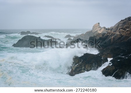 Waves crashing on rocks at Garrapata State Park, California.