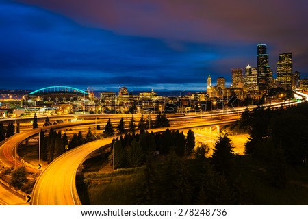 Night view of I-5 and the Seattle skyline from the Jose Rizal Bridge, in Seattle, Washington.