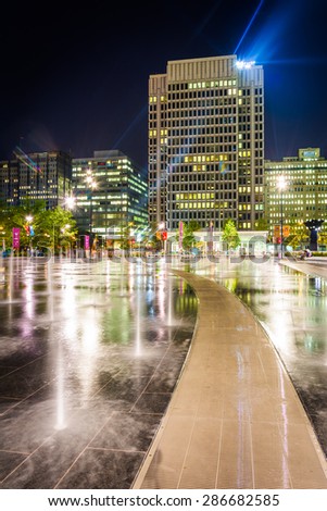 Fountains and buildings at night, at Dilworth Park, in Philadelphia, Pennsylvania.