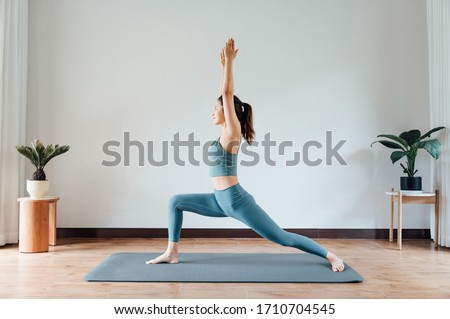 Similar – Image, Stock Photo Young woman doing stretching exercises on nature in mountains. Sports girl practicing yoga pose in leggings. beautiful forest landscape