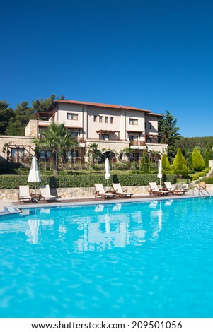 Kalithea (Halkidiki), Greece - Jul 22: Swimming pool of luxury hotel on coast of Mediterranean sea on 22 Jul 2014, Kalithea (Halkidiki) Greece