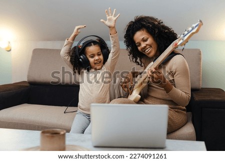 Similar – Image, Stock Photo Woman playing guitar in field with dry vegetation