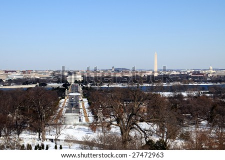 Skyline of Washington DC in winter, as seen from Arlington, Virginia, across the Potomac River. Arlington Memorial Bridge in front of the Lincoln Memorial.