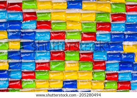 bags filled with colorful fluid color as a decoration background