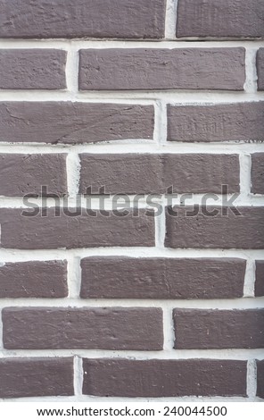 brown brick wall with white gap space between block