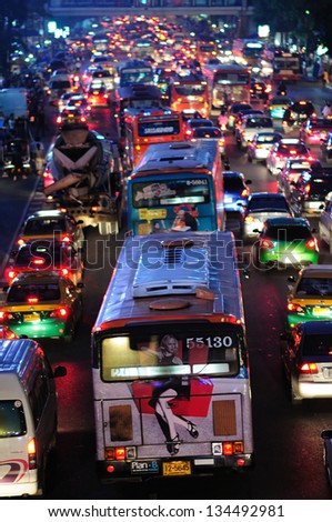 BANGKOK - OCTOBER 02: Commuters and motorists endure the traffic at rush hour on October 02, 2012 at Ratchaprasong District in Bangkok. Ratchaprasong District is one of Bangkok\'s busiest areas.