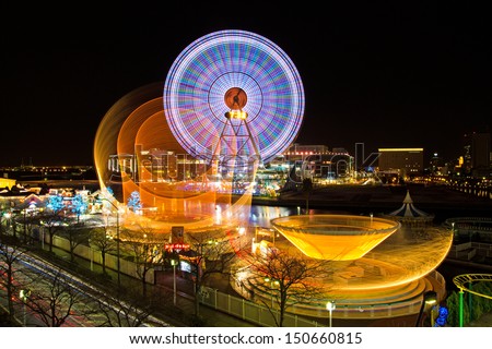 YOKOHAMA, JAPAN - JAN 15: Long-exposure image of amusement park rides at Yokohama Cosmo World. Jan 15, 2012 in Yokohama, Japan.