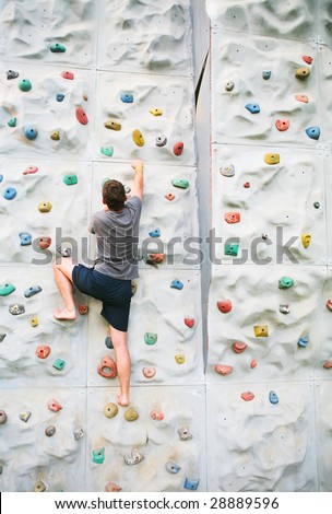 man climbing a wall