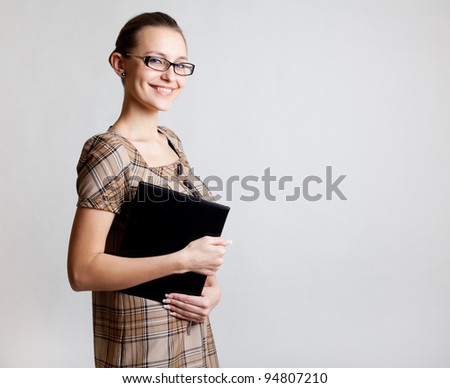 Portrait of a young woman, college student or teacher