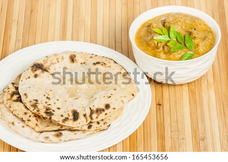 Chapati with Indian Mutton Curry - Fluffy homemade chapati (indian bread) served with delicious Indian mutton curry. Curry prepared using onions, curry leaves, garlic, ginger, cayenne & black pepper.