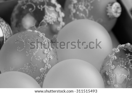 Old Christmas ornaments in a box - Vintage Christmas ornaments in a Black and white image. Shallow Depth of field used for background.