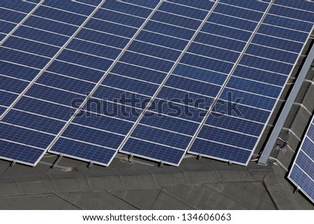 Solar panels installation. Detail of a installation of solar panels on a roof
