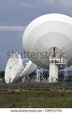 Satellite Antenna Detail. Vertical View of Several Big Satellite Dish in a Communication Center