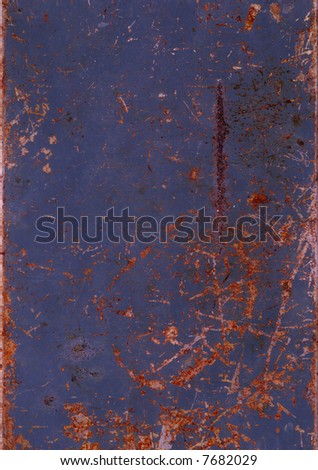 A sheet of rusted & scratched metal, suitable as a background texture.